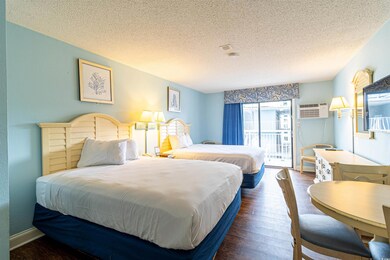 Bedroom with access to outside, a textured ceiling