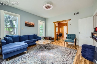 Living area with light wood-style flooring