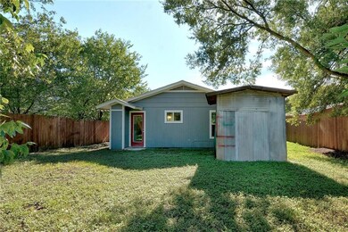 View of outbuilding with a fenced backyard