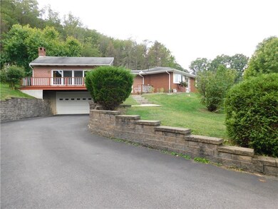 View of home with addition and driveway.