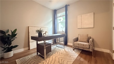 Home office featuring light wood-style floors