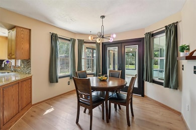 Kitchen dining area with enttrance to sunroom