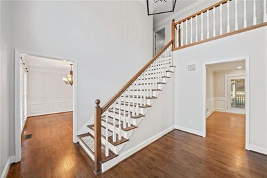 Stairway with a wainscoted wall, ornamental moldin