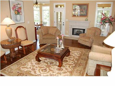 The great room opens to the kitchen, dining room a