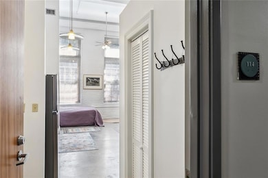 Down the hall, you'll find this darling Unit 114 w