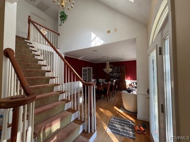 Stairway with high vaulted ceiling, hardwood / woo