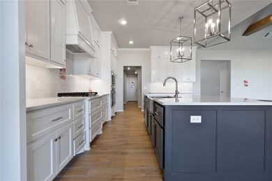 Kitchen featuring pendant lighting, a kitchen isla