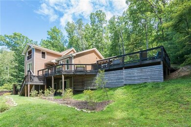 Custom contemporary home has a yard to match; sout