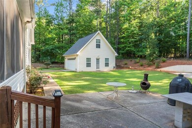 View of patio featuring an outdoor structure and a detached garage