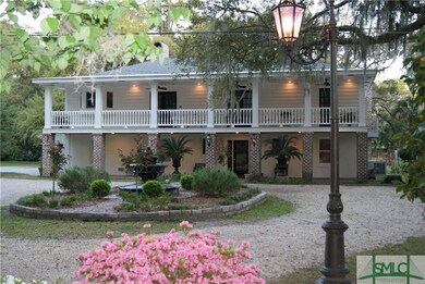 Front of home and circular drive/fountain area. An