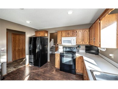 Kitchen has lots of light and storage space.