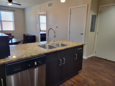 Kitchen featuring electric panel, dark hardwood / 