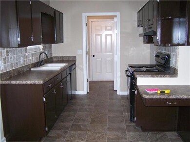 LOTS OF CABINET SPACE IN BEAUTIFUL KITCHEN