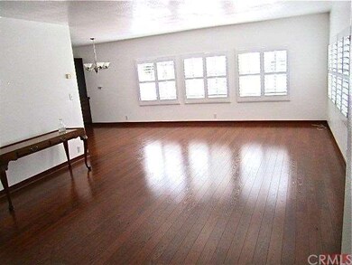 Wood laminate flooring, drywall on the walls, and 