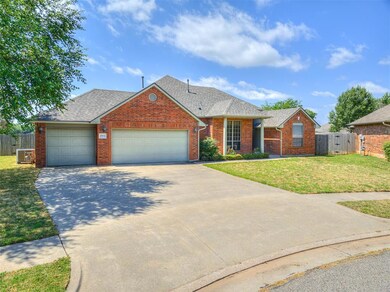 View of front of home with a garage and a front la