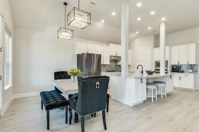 Dining area featuring light wood-style floors, a 