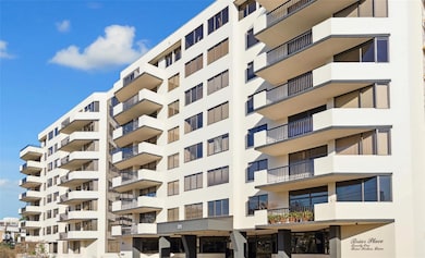 Modern mid-rise condominium with multiple balconie