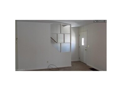 The entry area shows the fresh painted neutral wal