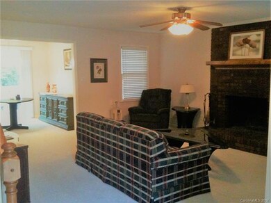 Living Room with wood burning fire place.  An elec