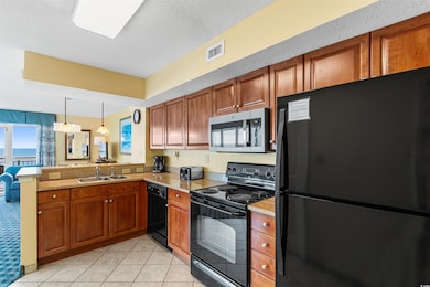 Kitchen featuring black appliances, sink, kitchen 
