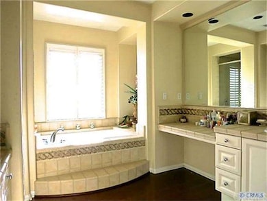 large master bath with tub and separate shower