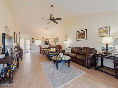 Living room featuring high vaulted ceiling, ceilin