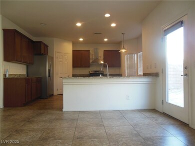 Kitchen with island exhaust hood, recessed lightin