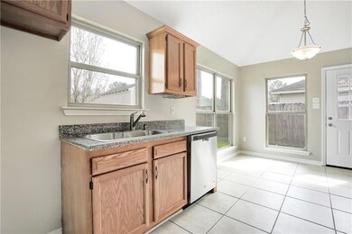 Kitchen with new granite counter tops and new stai