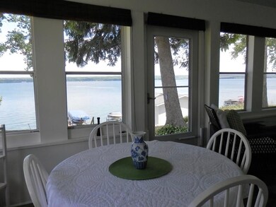 SPANNING VIEWS FROM THE LAKESIDE PORCH