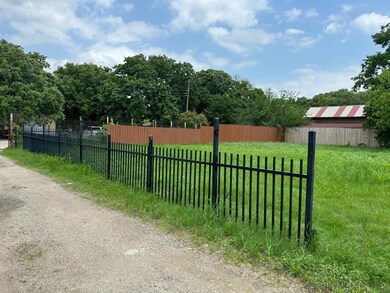 View of gate with a yard