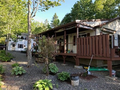 nicely landscaped, note garage in...
