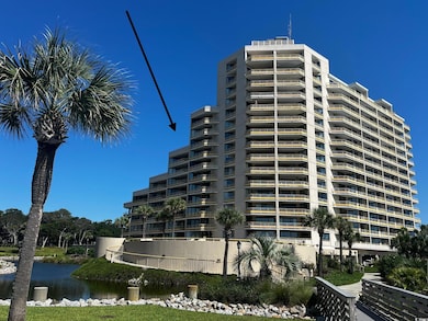 View of apartment building / complex featuring a water view