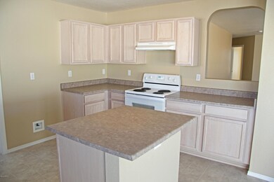 Open Kitchen with Light Wood Cabinets