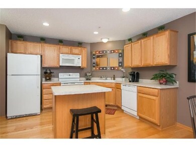 Kitchen features kitchen island and lots of cabine