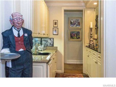 The artful statue of  Higgins, the butler, greets 