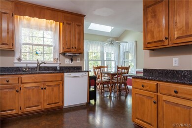 Kitchen has cork floors and eat in area.