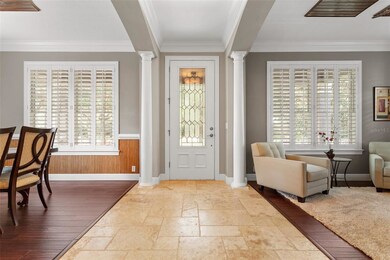 Front entrance with travertine tile in foyer and b