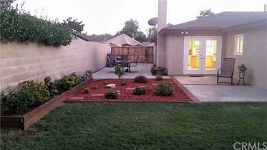 Backyard with 2 tranquil sitting areas.