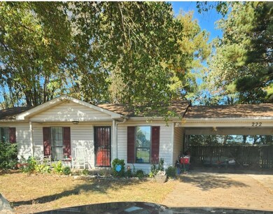 Ranch-style home featuring a carport