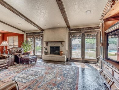 Large living area with wood floors and wood burnin