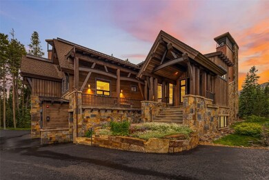 View of front of property with stone siding, board