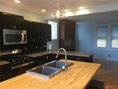 Deep rich kitchen cabinets, butcher block center i