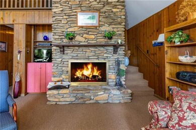 Floor-to-ceiling Stone Fireplace perfect for those