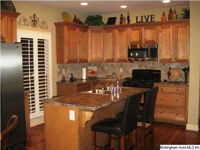 Gorgeous gourmet kitchen with an island and GAS st