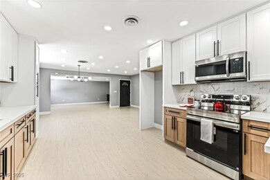 Kitchen with stainless steel appliances, recessed