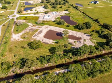 Aerial overview of property's location with a large body of water