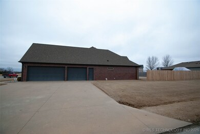 Exterior - Side entrance to  3 car garage - faces