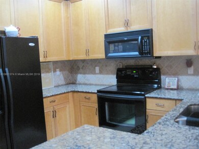 UPDATED KITCHENWITH GRANITE COUNTERTOPS, STONE BACKSPLASH & 42 INCH WOOD CABINETRY