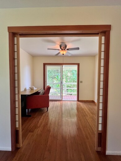 Shoji doors open shows you the first bedroom that has sliding doors to the private lanai area