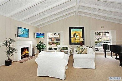 Living Room with Vaulted and Beamed Ceilings and F